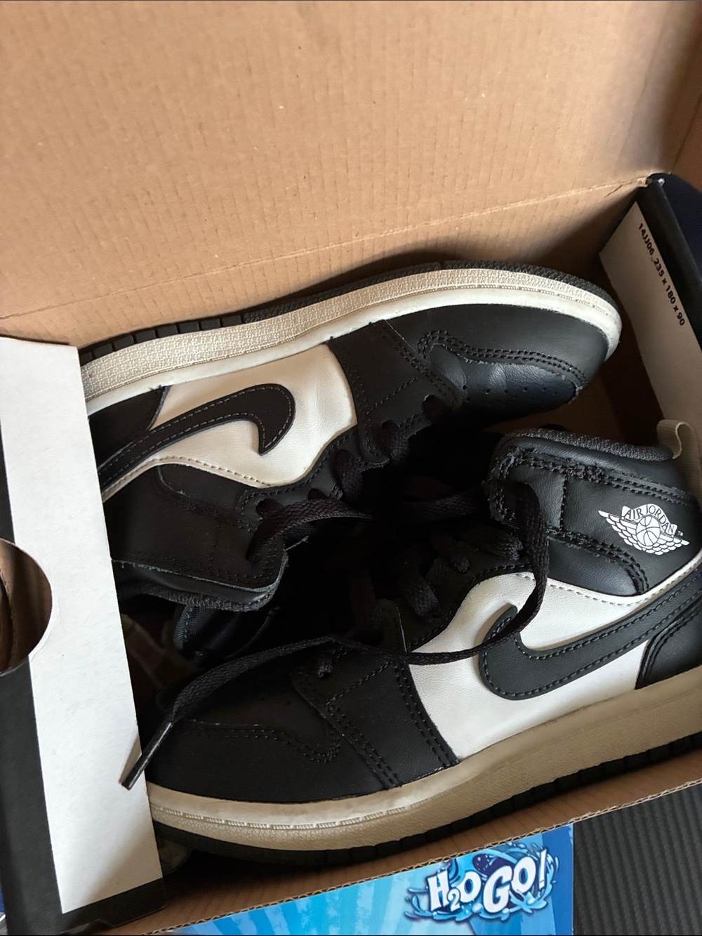 Jordan Kids Black and White High-Top Sneakers